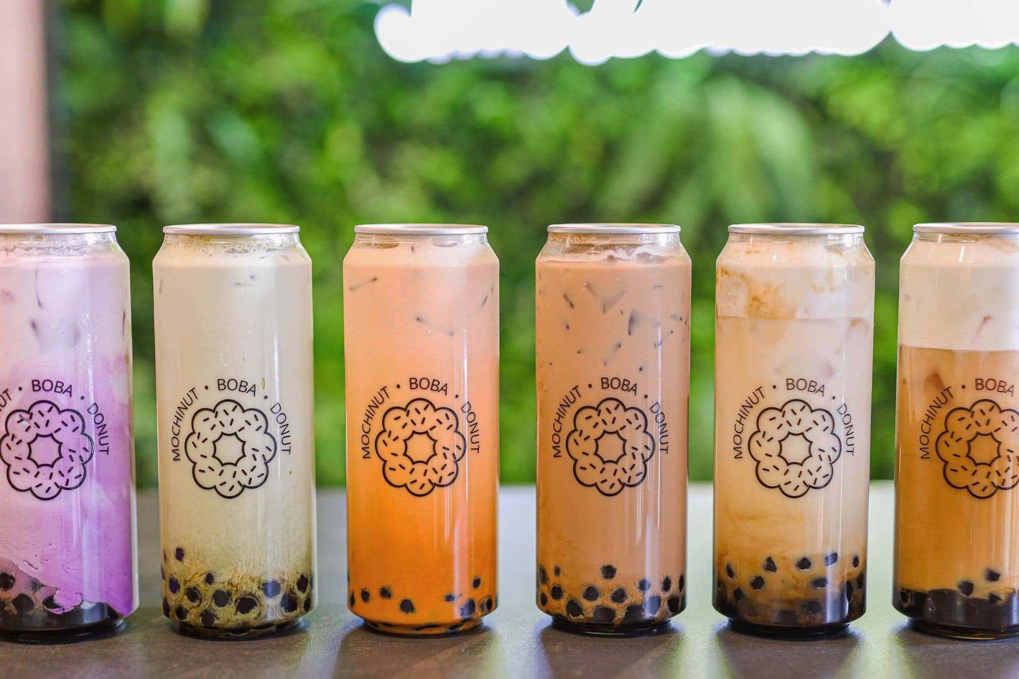 Mochinut Bubble Tea Collection featuring various flavors including classic milk tea, taro, matcha, and thai tea